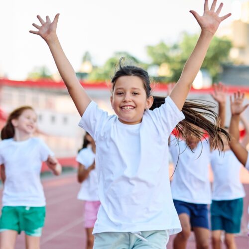 Young,Children,Having,Athletic,Exercise,Class,Running,On,The,Track,